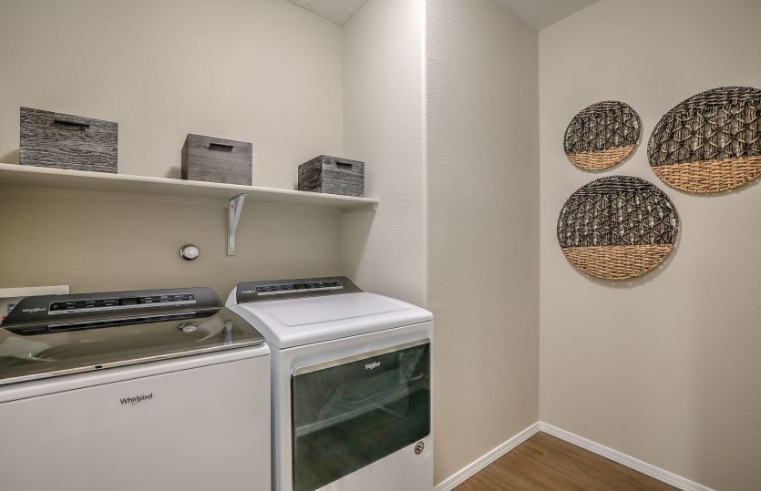 Laundry room with washer and dryer plus a storage shelf  or optional cabinets.