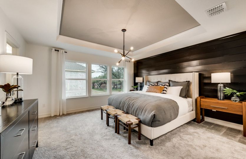 Spacious owner's suite with large windows and private bath
