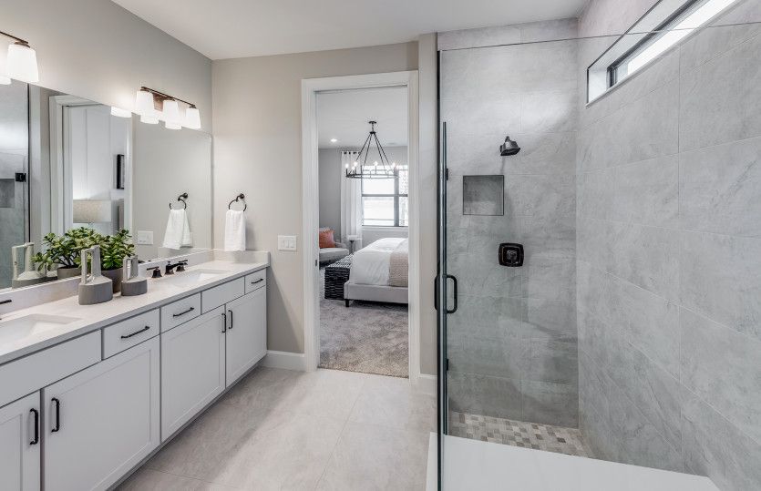 Owner's suite bathroom with enclosed glass shower