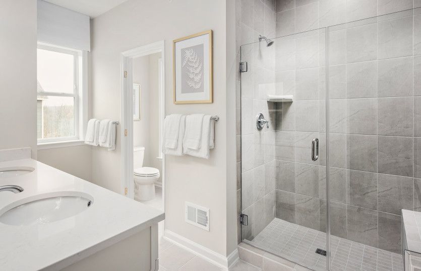 Owner's Bath with Double Sinks and a Walk-in Shower