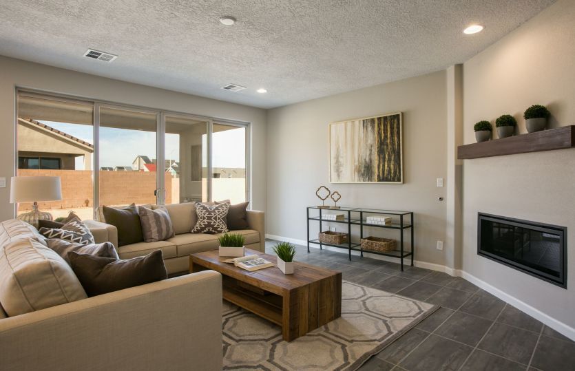 A large sliding glass door takes your indoor gatherings to the backyard and covered patio.