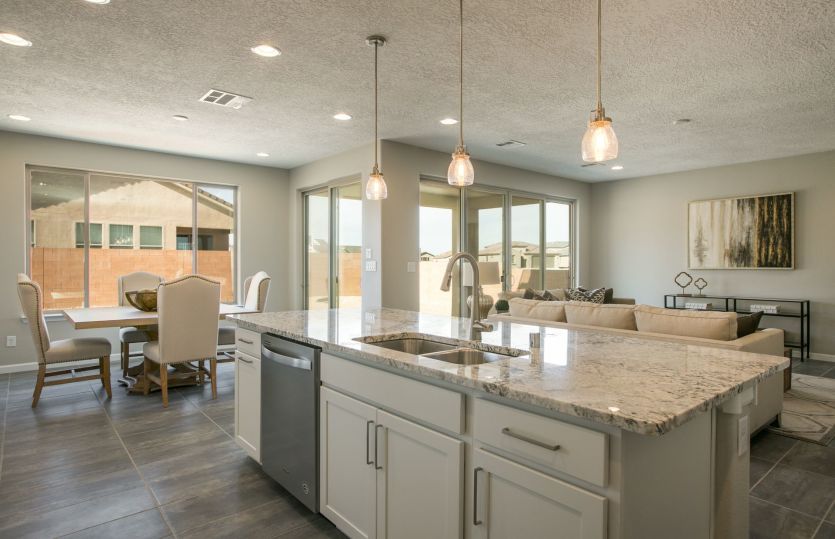 Your expansive kitchen island overlooks the gathering room as well as the cafe for seamless entertai