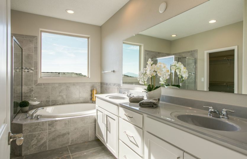 Private from the other rooms of the Trento home is your personal owner's bath shown with a tile tub.