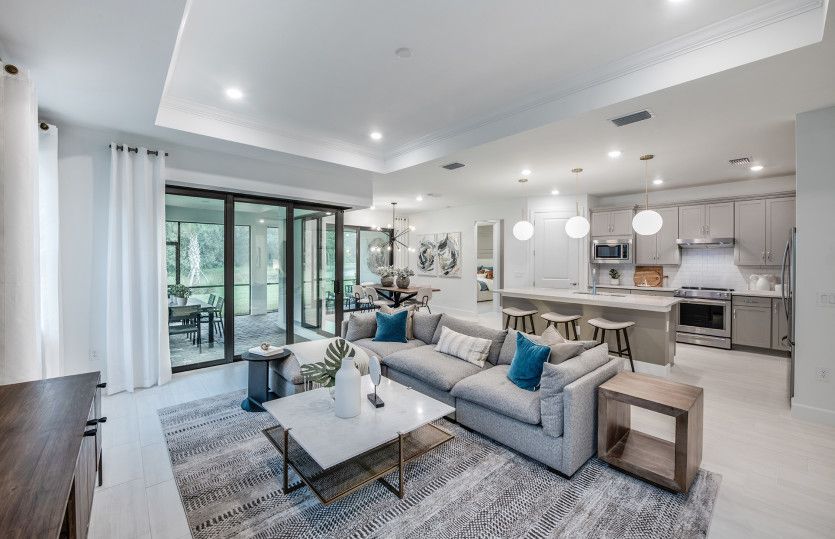 Connected kitchen, gathering and dining spaces