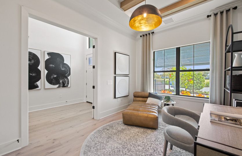 Den with french door and ample natural light