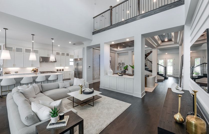 Gathering room with view of loft space overhead