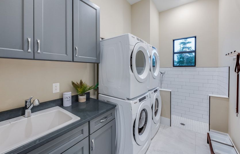 Laundry room with optional dual washer & dryer, plus pet spa