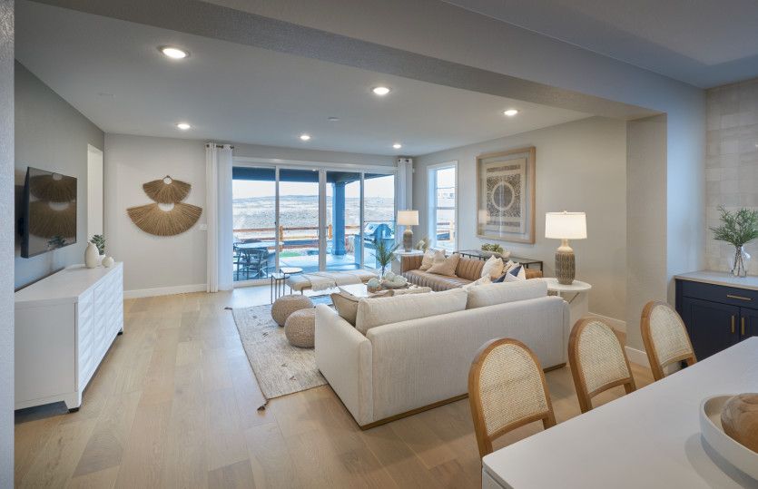 Entertain with ease in the spacious gathering room boasting a large sliding glass door to the backya