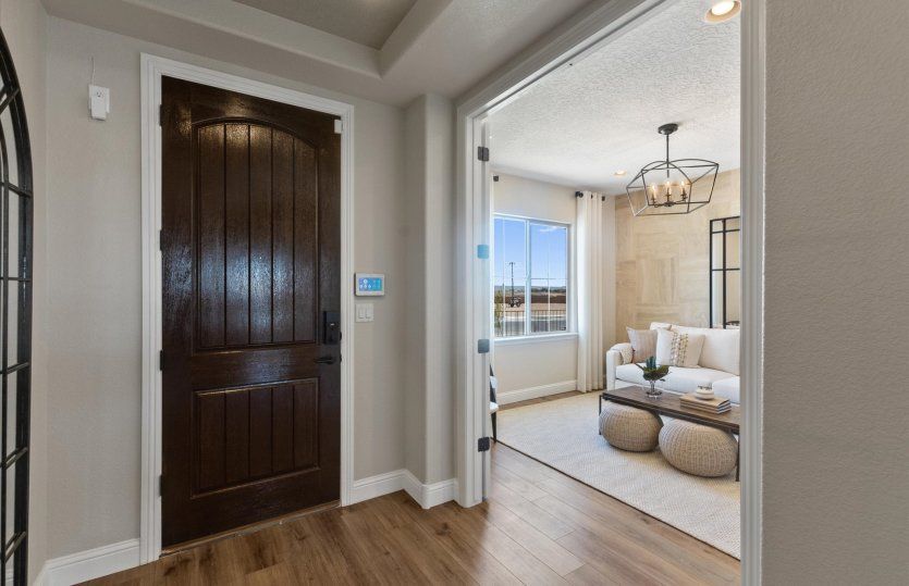 Right off the foyer, you'll find a private den/flexible living space.