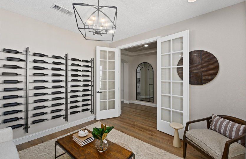 Upgraded French doors add a layer of privacy to the den.