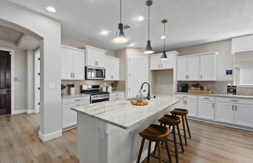 Enjoy breakfast each morning at your built-in, island bar.