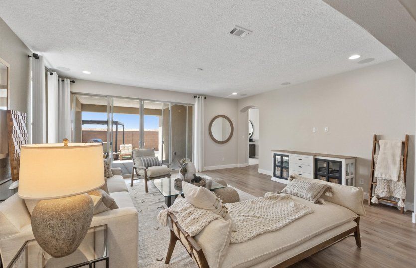 Enjoy a brightly lit gathering room thanks to the large window and backyard sliding glass door.