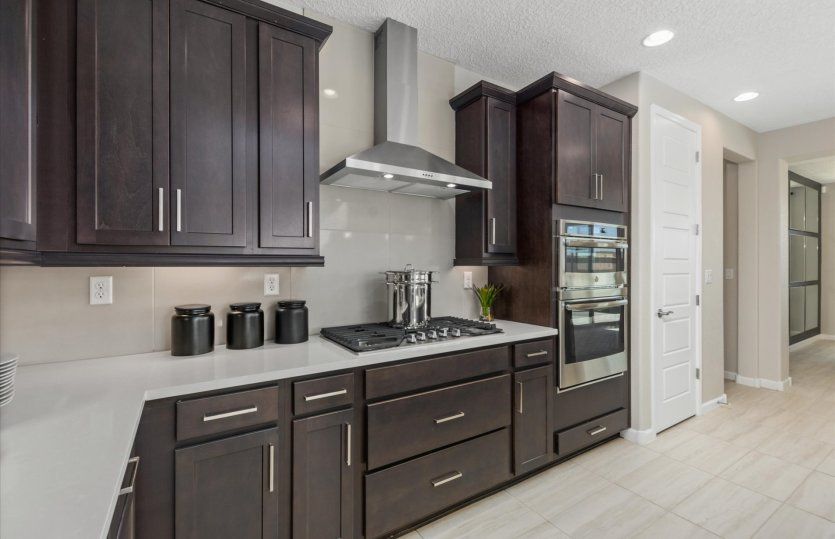 The upgraded chef kitchen includes built-in stainless-steel appliances.