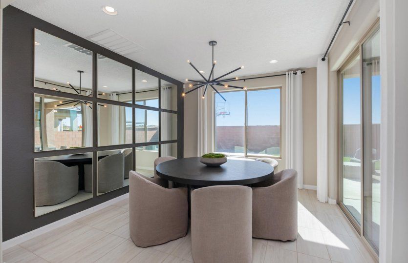The café is brightly lit thanks to the large window and sliding glass door to the backyard.