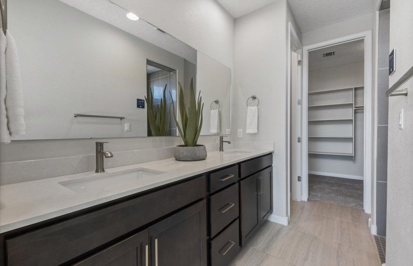 The owner's bath features two sinks and a huge mirror making getting ready each morning a breeze.