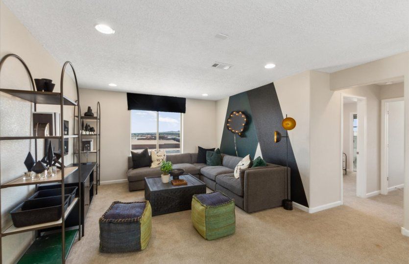 Upstairs, you'll find a loft that can be utilized as a game room or secondary living space.