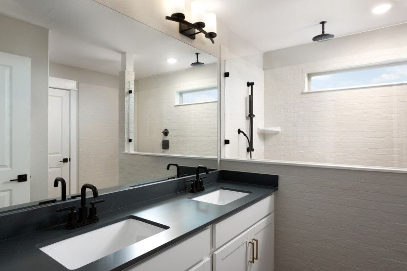 Owner's bathroom with double vanity and tile floors