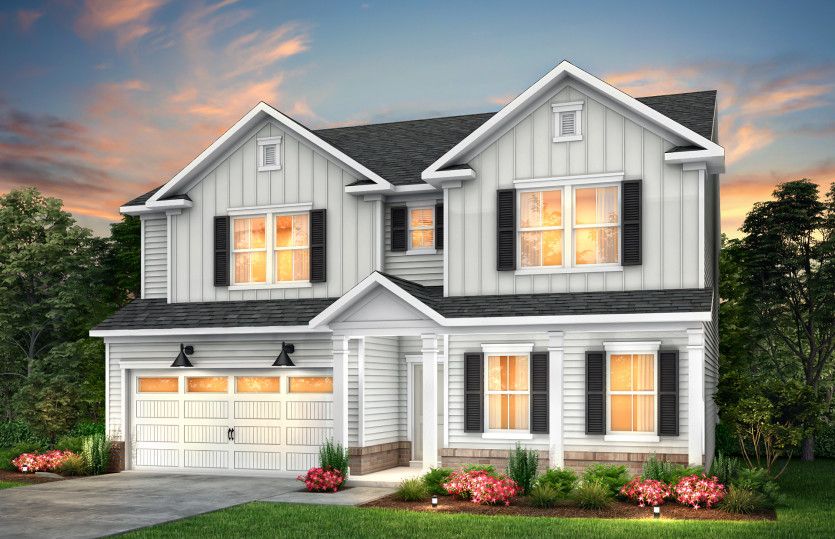 Mitchell Exterior LC2G features siding, brick, covered front siting porch and 2 car garage