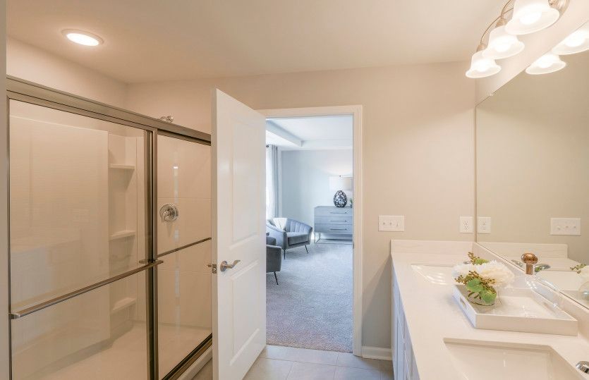 Owner's Bathroom with Dual Sink Vanity, Walk-in Shower and Linen Closet