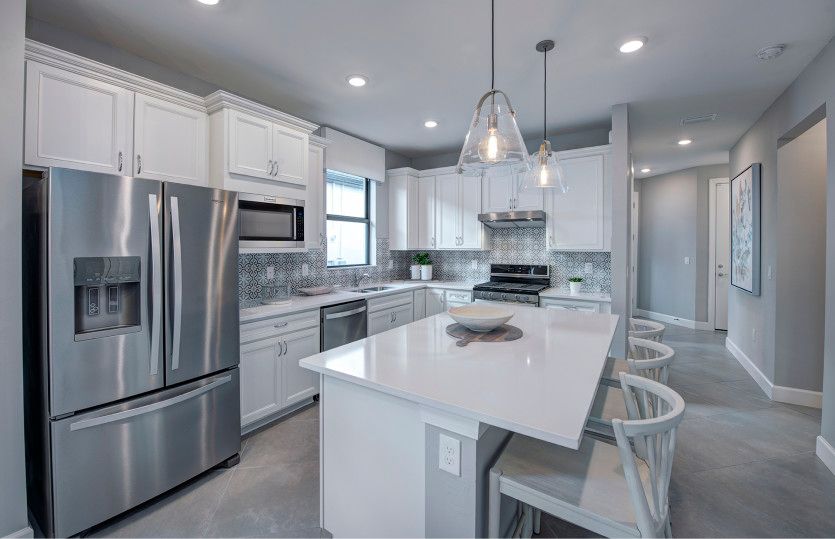 Kitchen with large center island and stainless steel appliances