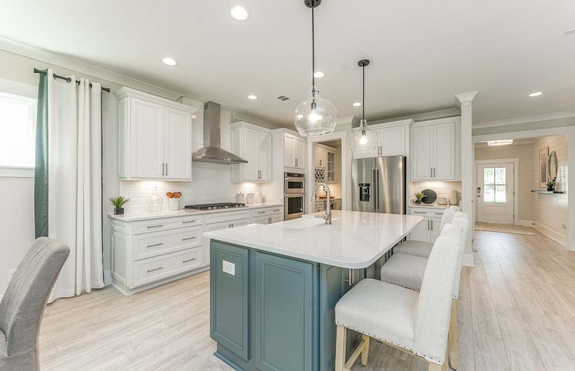 Luxurious Kitchen with Stainless Steel Appliances and Tile Backplash