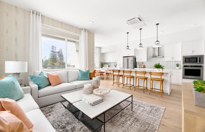 Open-concept gathering area with view of kitchen
