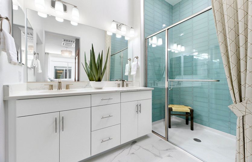 Owner's bathroom with double vanity and walk-in shower