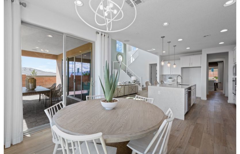 Café area just off the kitchen has a sliding glass door leading to the covered patio.