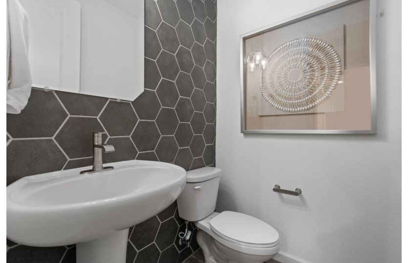 Powder room on first floor offers convenience for guests.