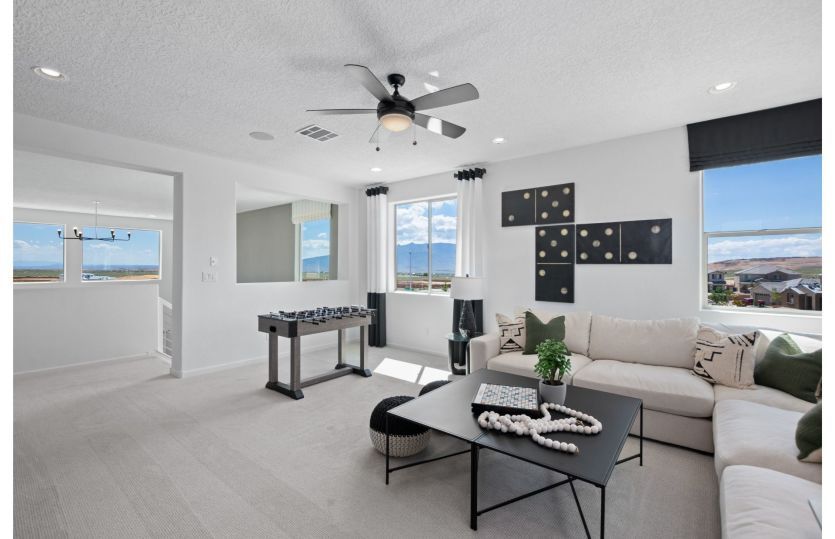 The upstairs loft is great for a family game room or an additional living space to entertain family