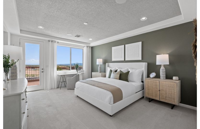 Spacious owner's suite shown here with a private balcony.