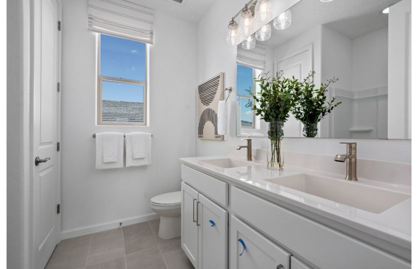 Full bath on the second floor serves the secondary bedrooms and can be enhanced with a second sink.