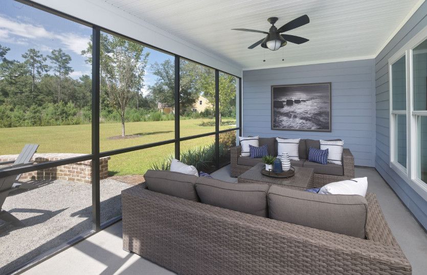 Enjoy the backyard view in the screened porch area.