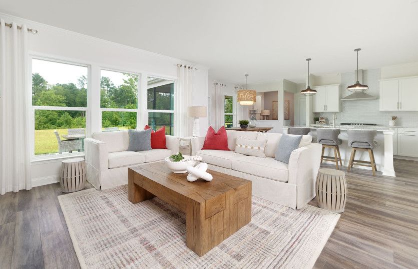 The new construction home's open floorplan is ideal for gathering and lounging.