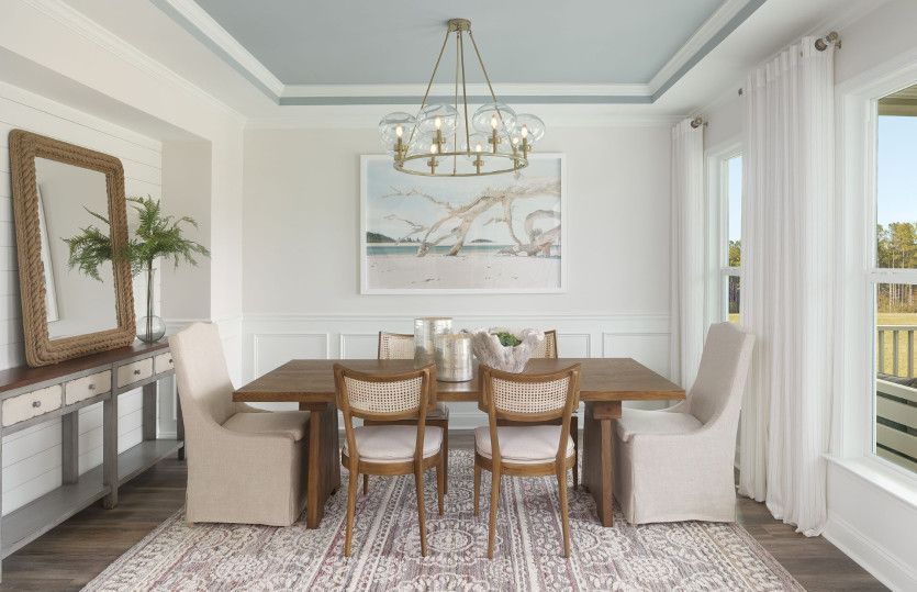 Enhance your dining experience with an optional tray ceiling in the dining room to complement the el