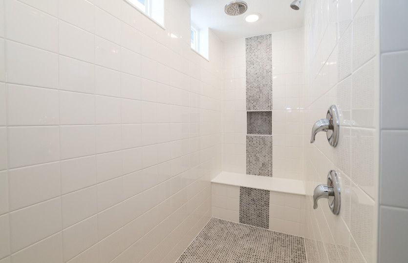 Upgrade your home when you add tile accents to the owner's shower.