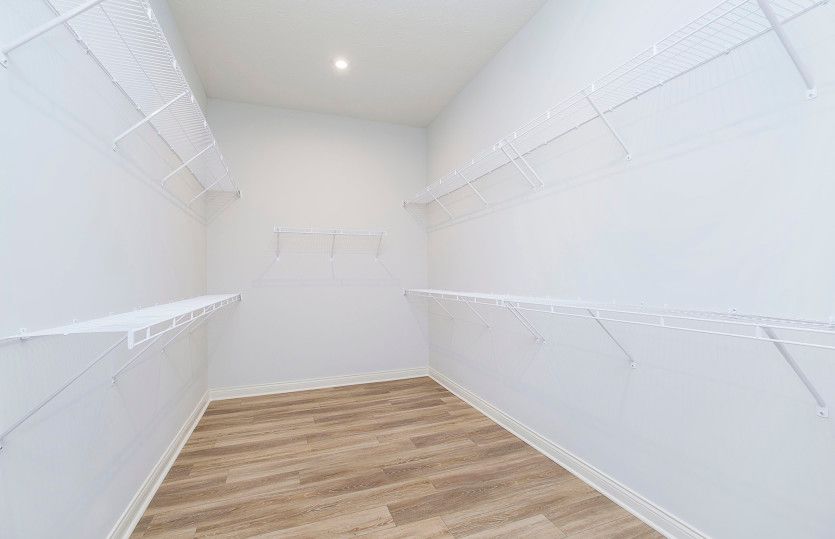 Huge Owner's Closet with Pass Thru to Laundry Room