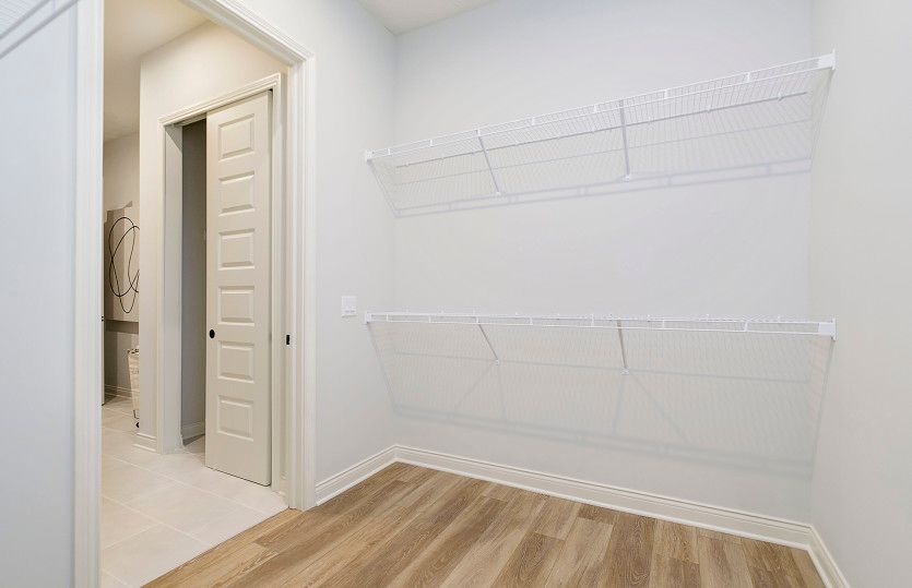 Huge Owner's Closet with Pass Thru to Laundry Room