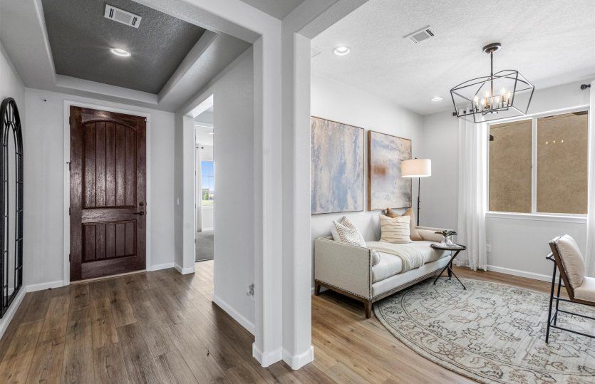 Right off the foyer, you'll find a private den/flexible living space.