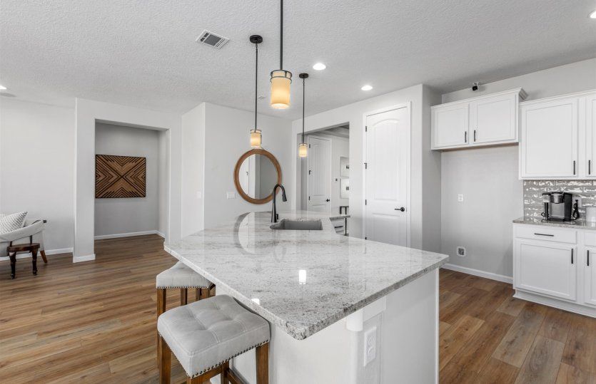 Kitchen with large island and breakfast bar designed for busy mornings.