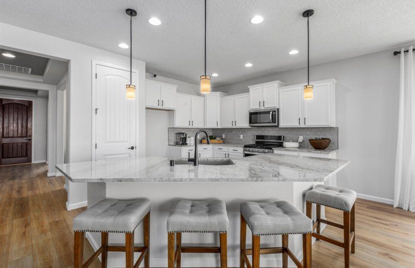 Add pendant lighting above the kitchen island for even more design appeal at the kitchen.