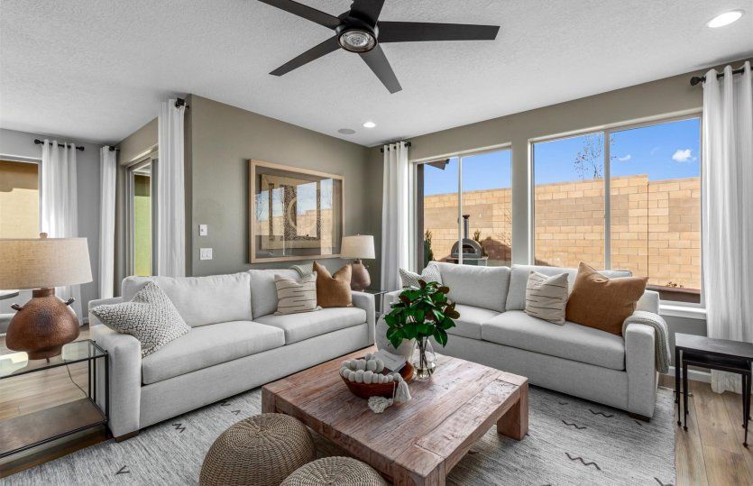 Gathering room opens up to the kitchen for a spacious, airy interior.