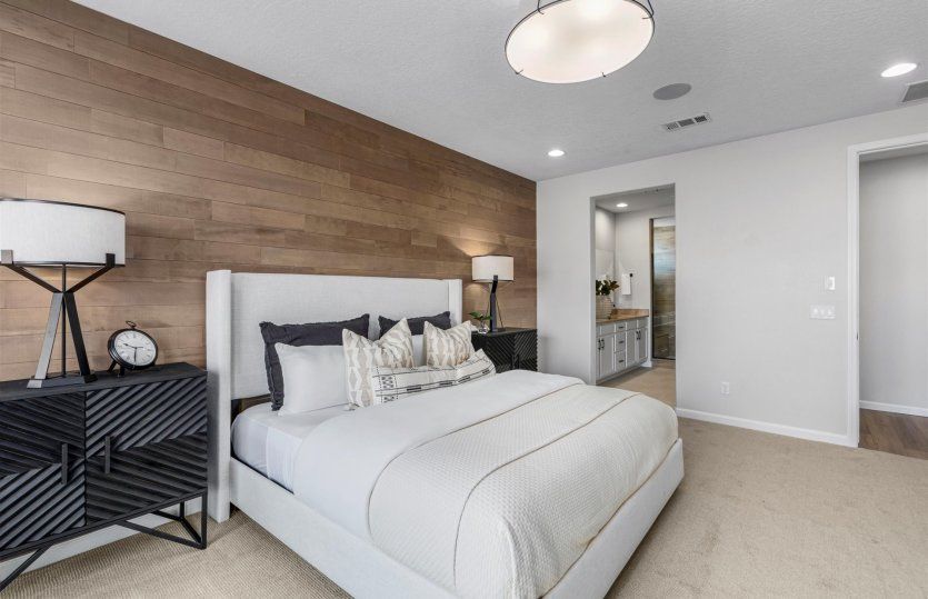 Owner's suite featuring an accent wall and private bathroom that can be configured to fit your needs