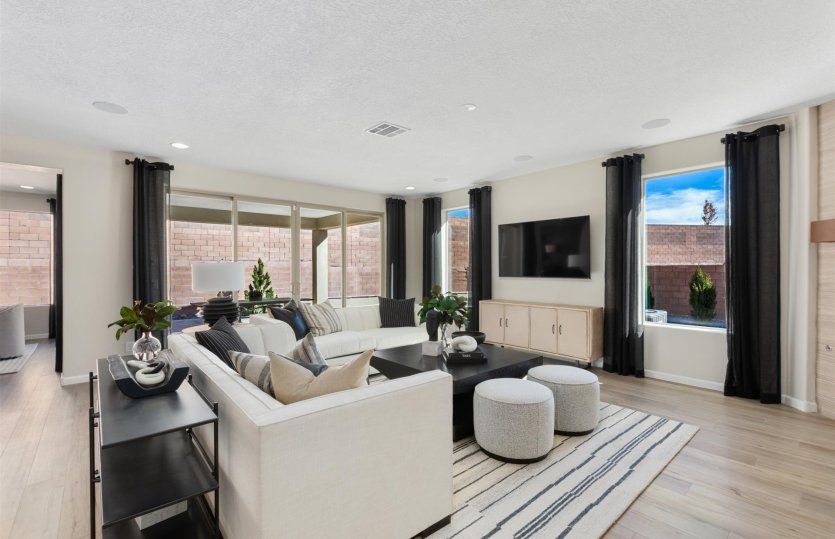 Gathering room modeled with extra seating perfect for lounging comfortably with the whole family.