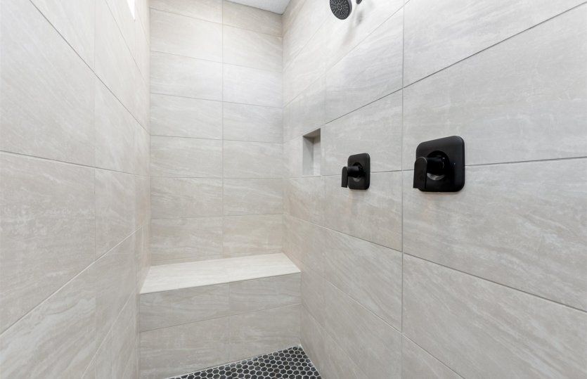 Owner's bath featuring a large walk-in shower.