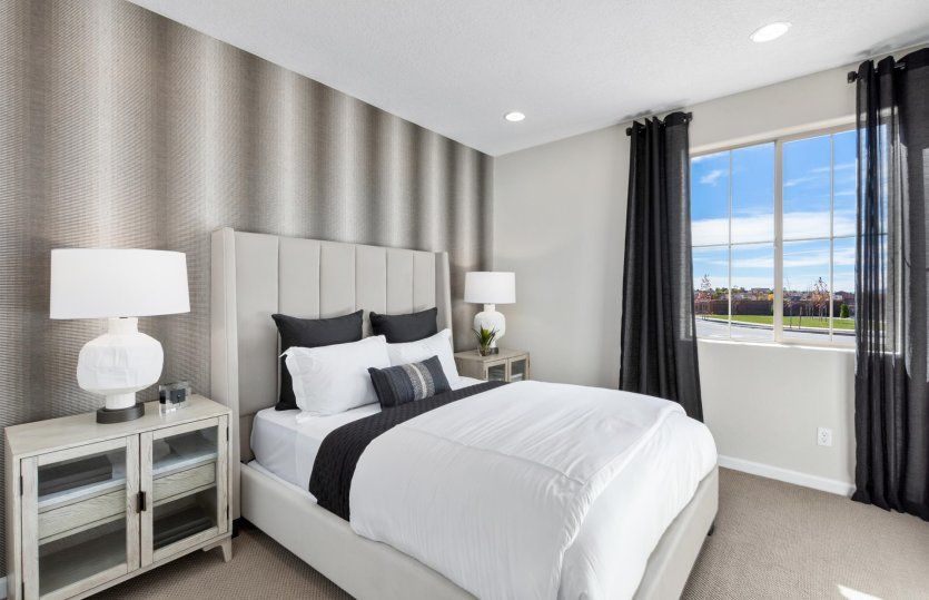 Second bedroom features a large window for plenty of natural light.