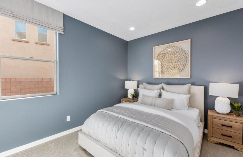 Optional suite features guest bedroom and attached bathroom in place of a third-car garage.
