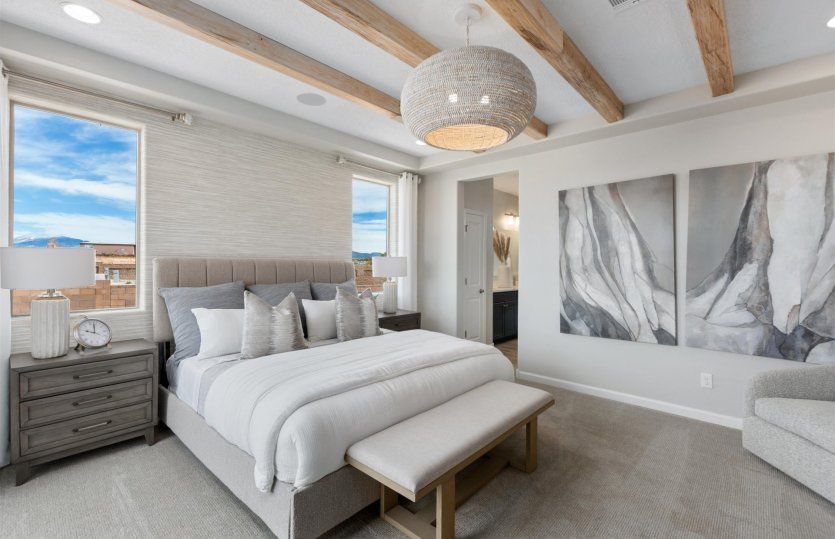 Gorgeous owner's suite with accent lighting fixtures and ceiling.