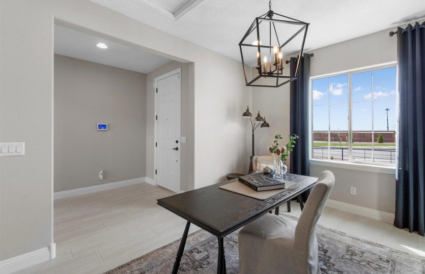 The den off the front door entry makes a nice space for a home office or create your own hobby or ki