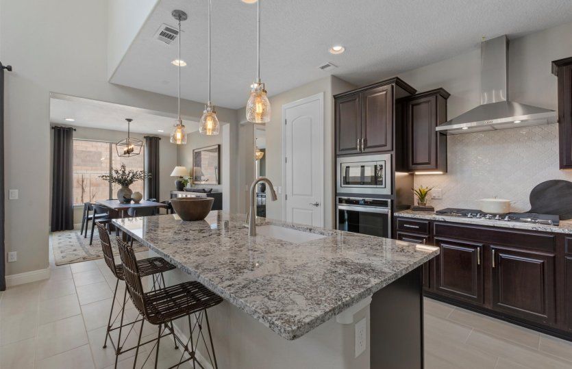 Choose to enjoy casual meals at the kitchen island countertop or in the cafe just off the kitchen.